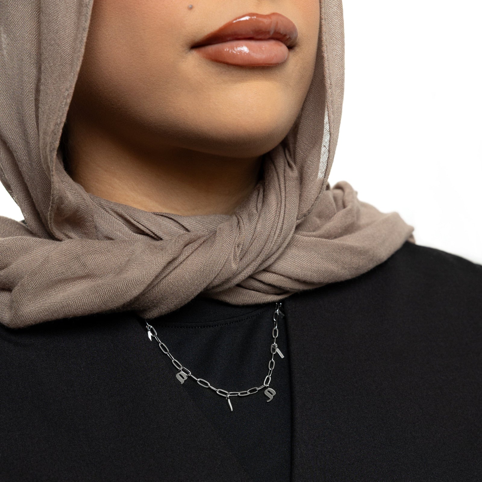 Silver Mama Charm Necklace as worn by the model.