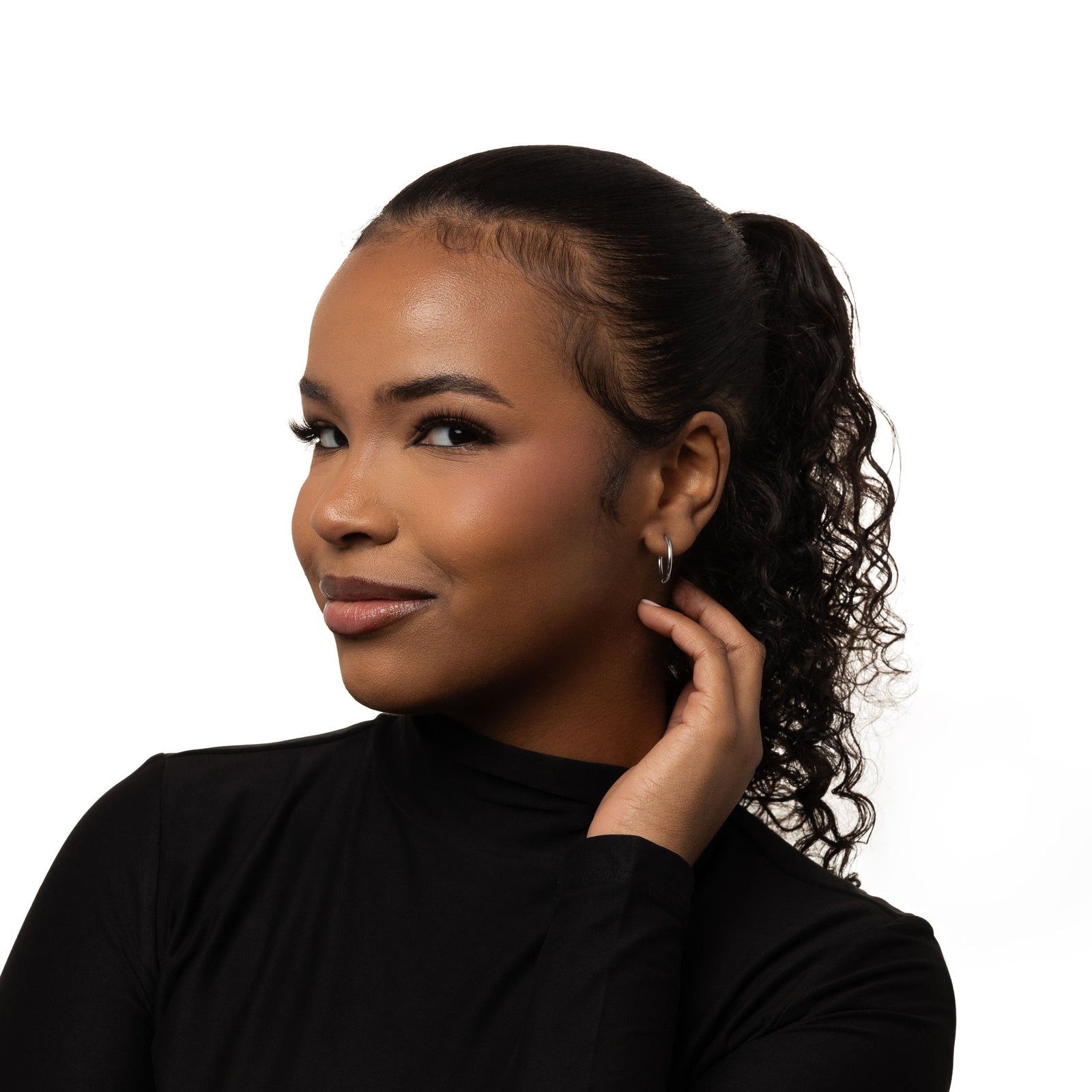 Photo of the model wearing the silver Medium Essential Hoops | 16mm on their left ear.
