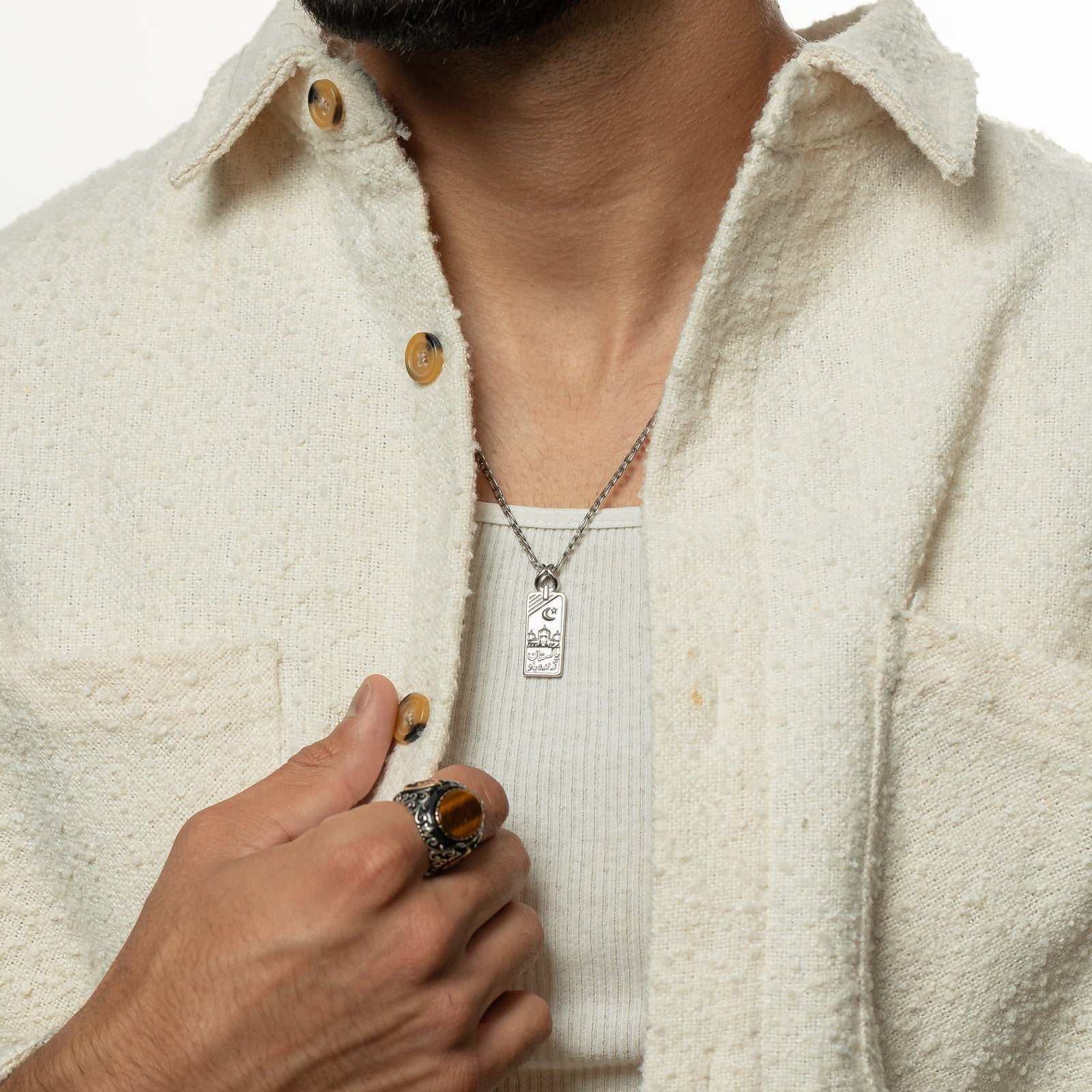Man wearing the silver Pakistan Zindabad Necklace
