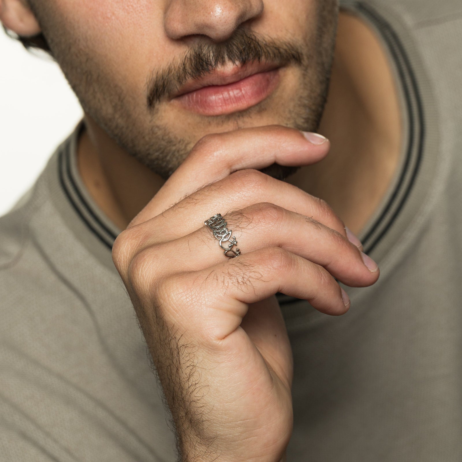 Close up of the model's right hand wearing the silver "Walk to Me and I'll Run to You" Calligraphy Ring | Men on their right ring finger.