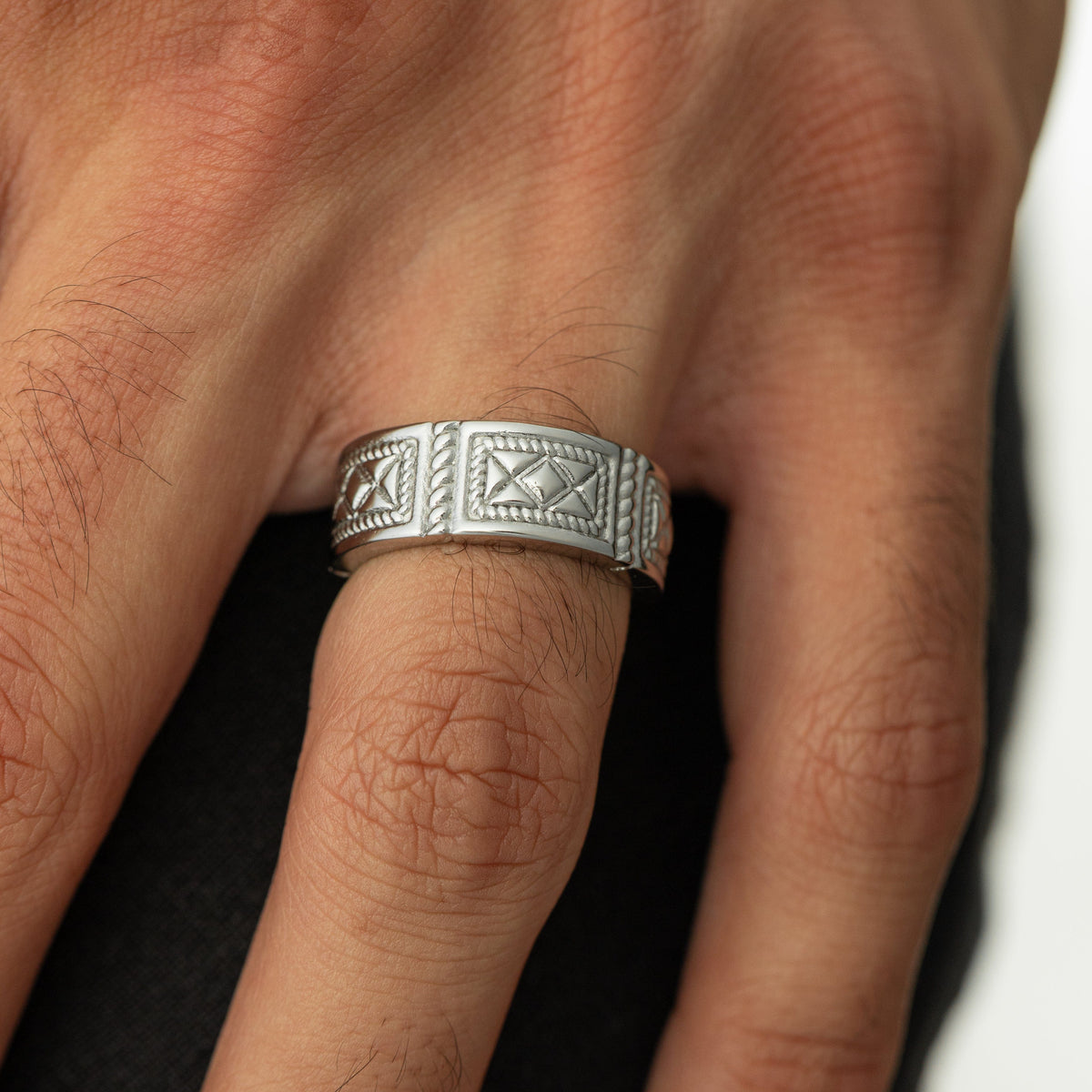 Man wearing the silver Damascus Tile Ring
