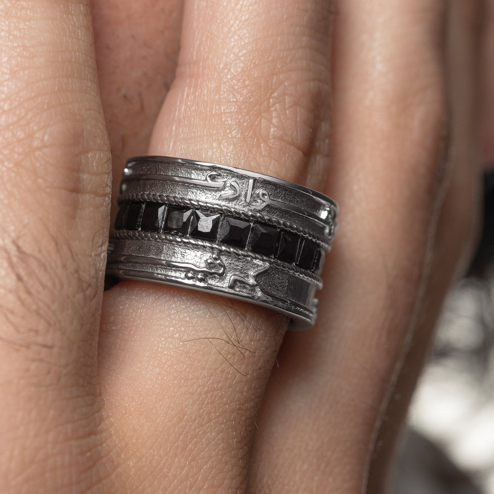 Close up of the silver "Perhaps you dislike what's good for you" Stripe Ring | Men as worn by the model.