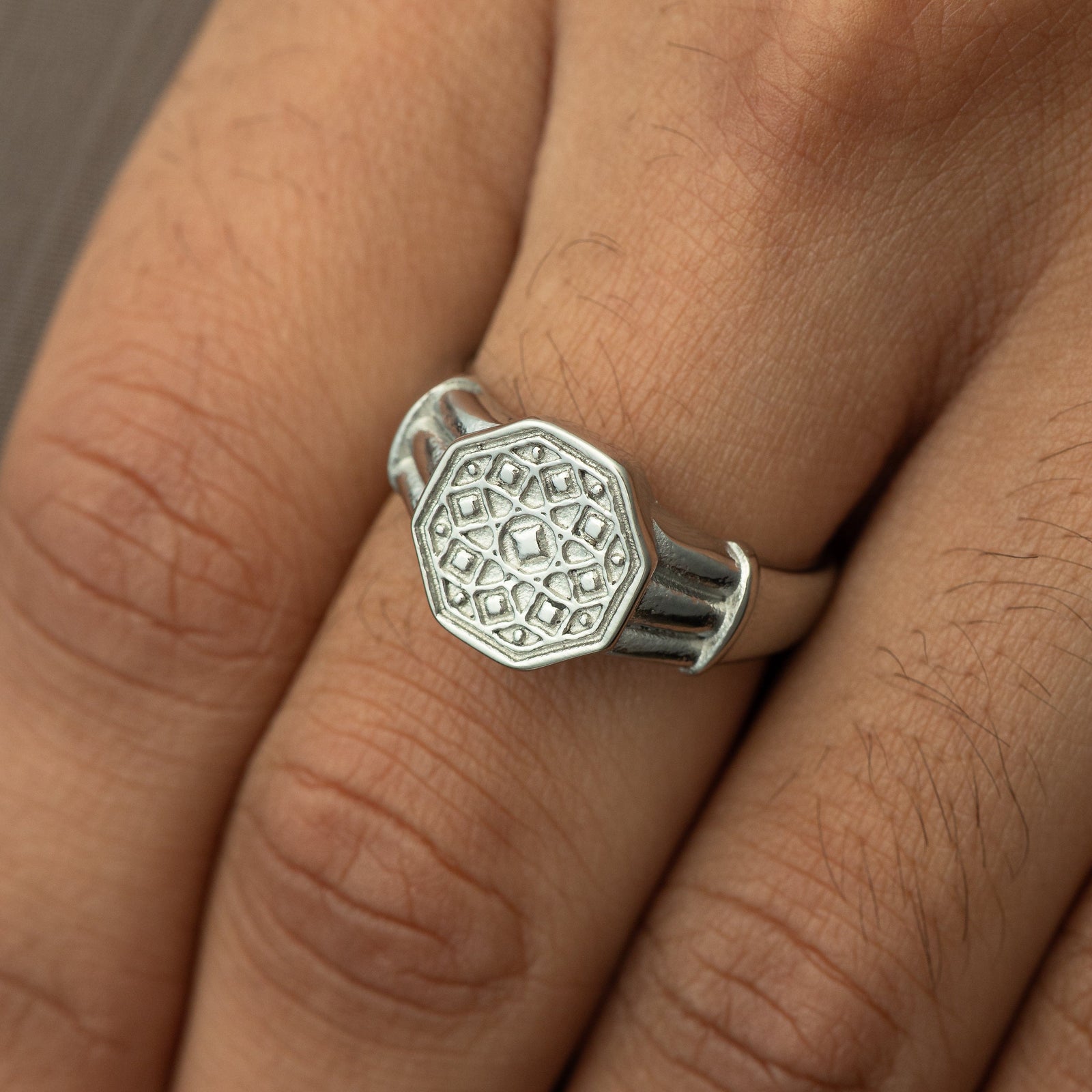 Close up photo of the silver Syrian Mosaic Ring | Men as worn by the model.