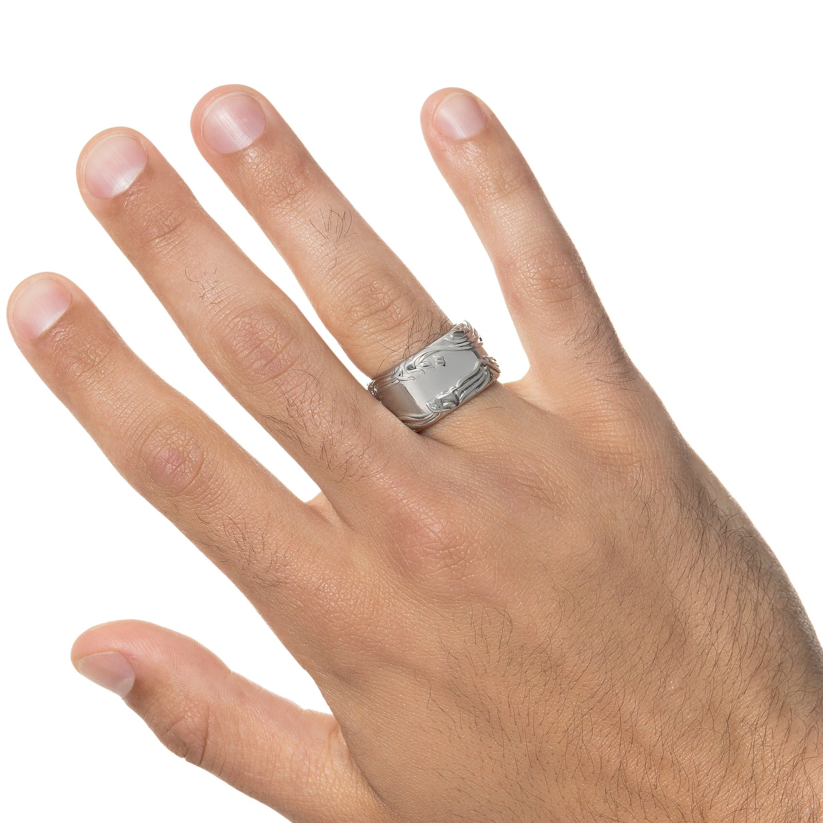 Photo of the model's right hand, the silver "The wound is where light enters you" Rumi Ring is on their right ring finger.