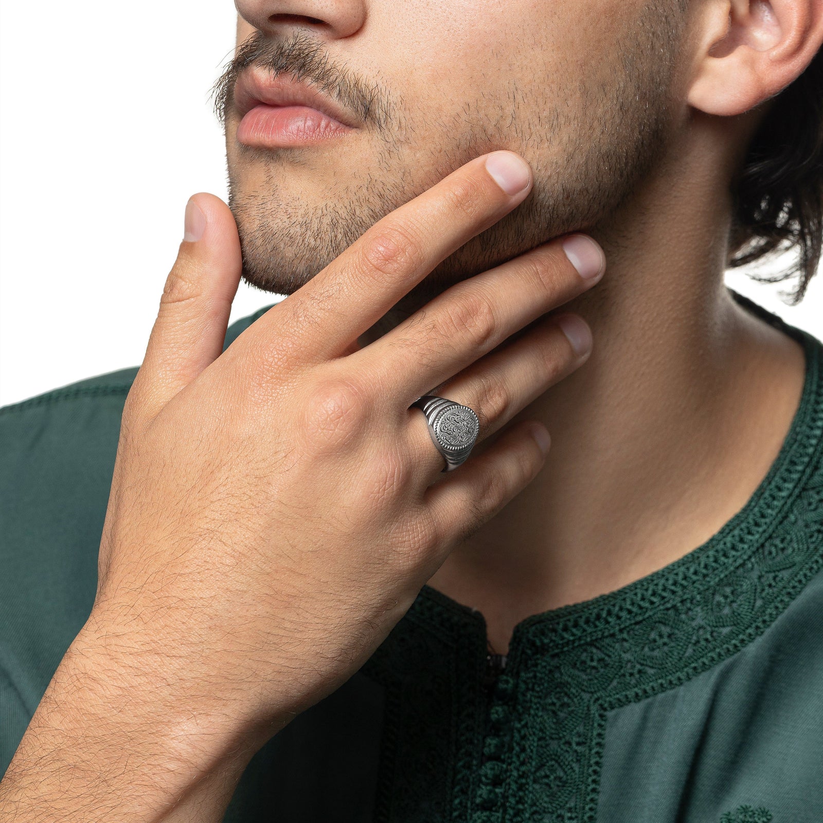 Model is touching their face with their right hand. The model is wearing the silver "Walk to Me, and I'll run to you" Medallion Ring | Men on their right ring finger.