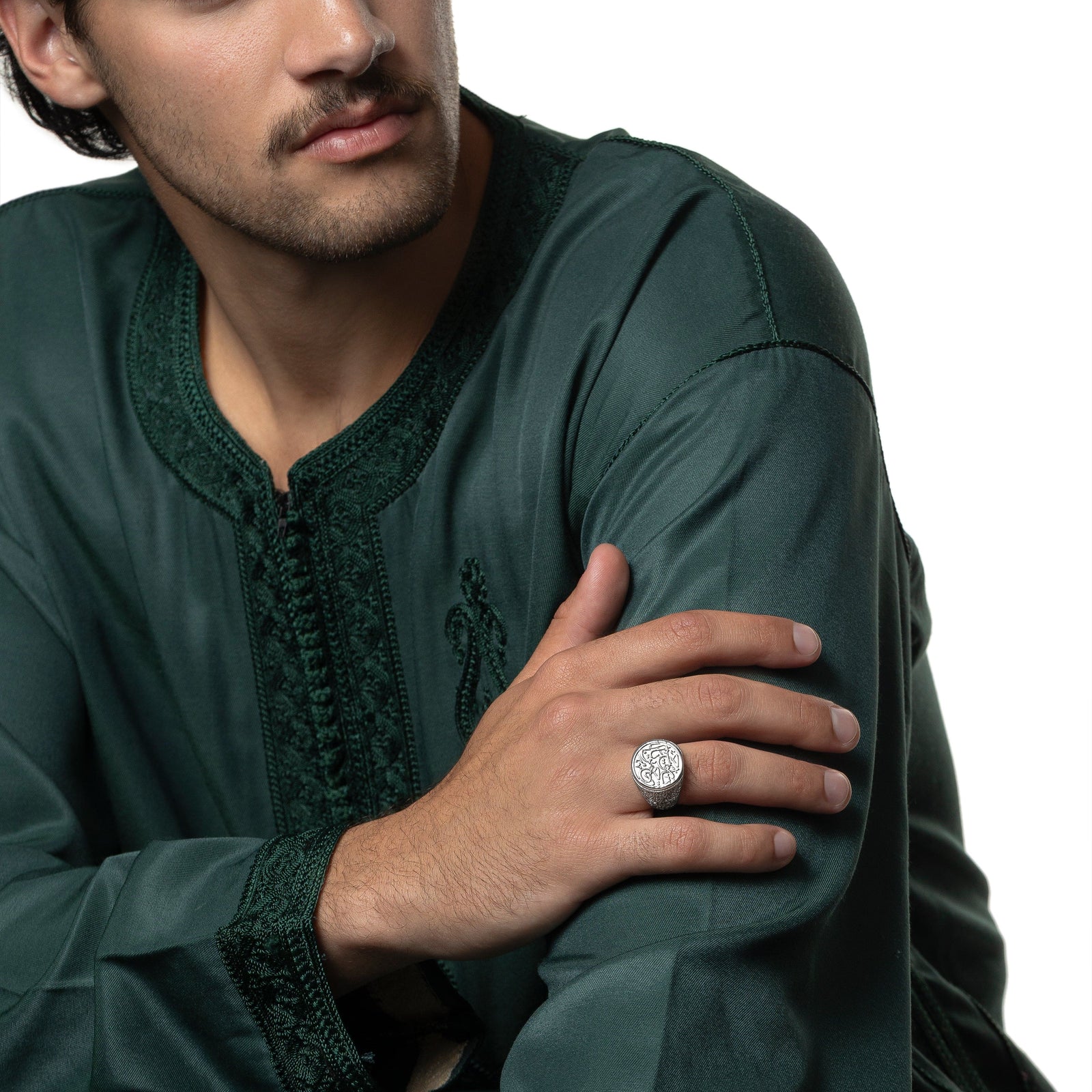 Model's right hand is touching their left arm showing the silver "Ya Rahman, Ya Raheem" Ring on their right ring finger.