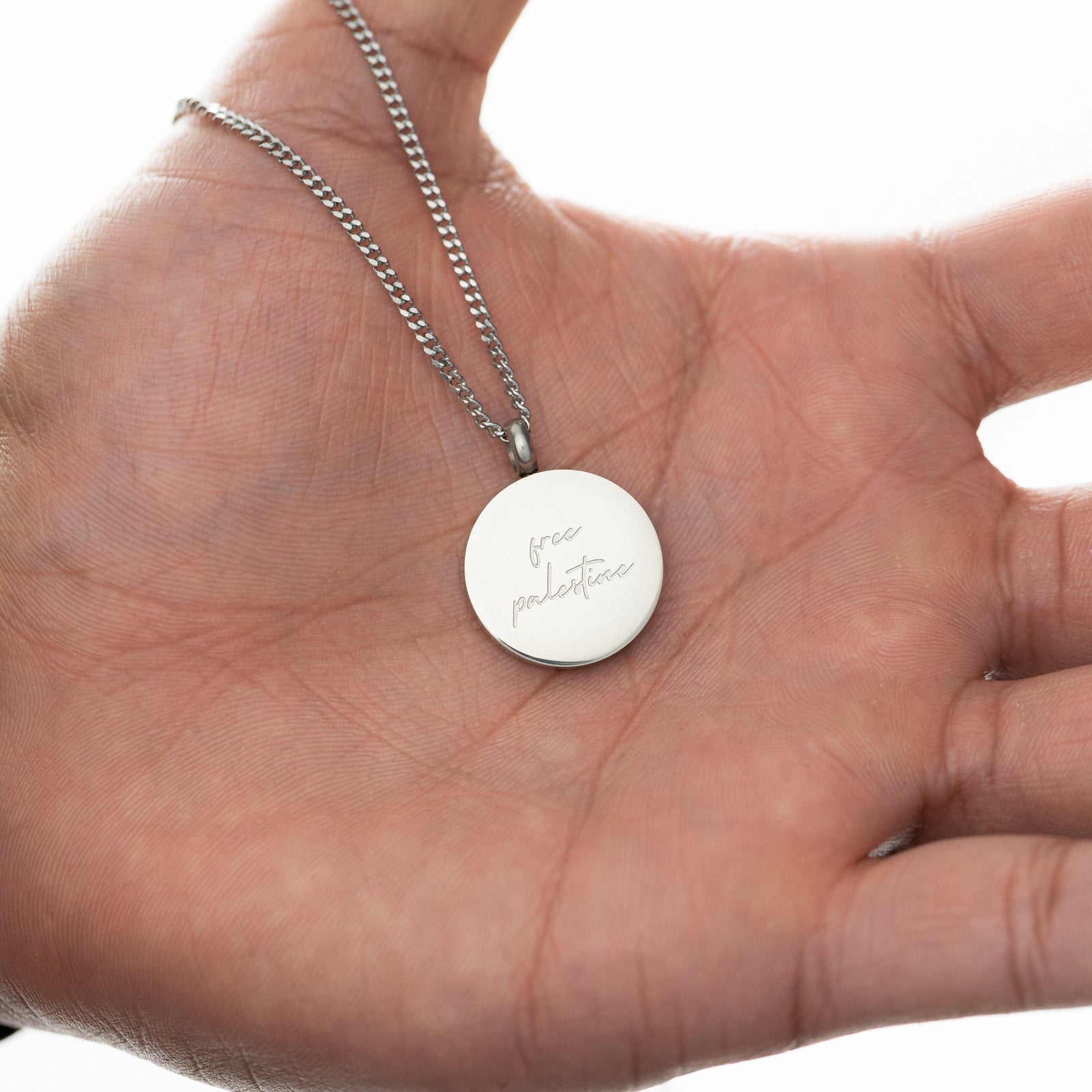 Al-Aqsa ‘Free Palestine’ Necklace on a hand.