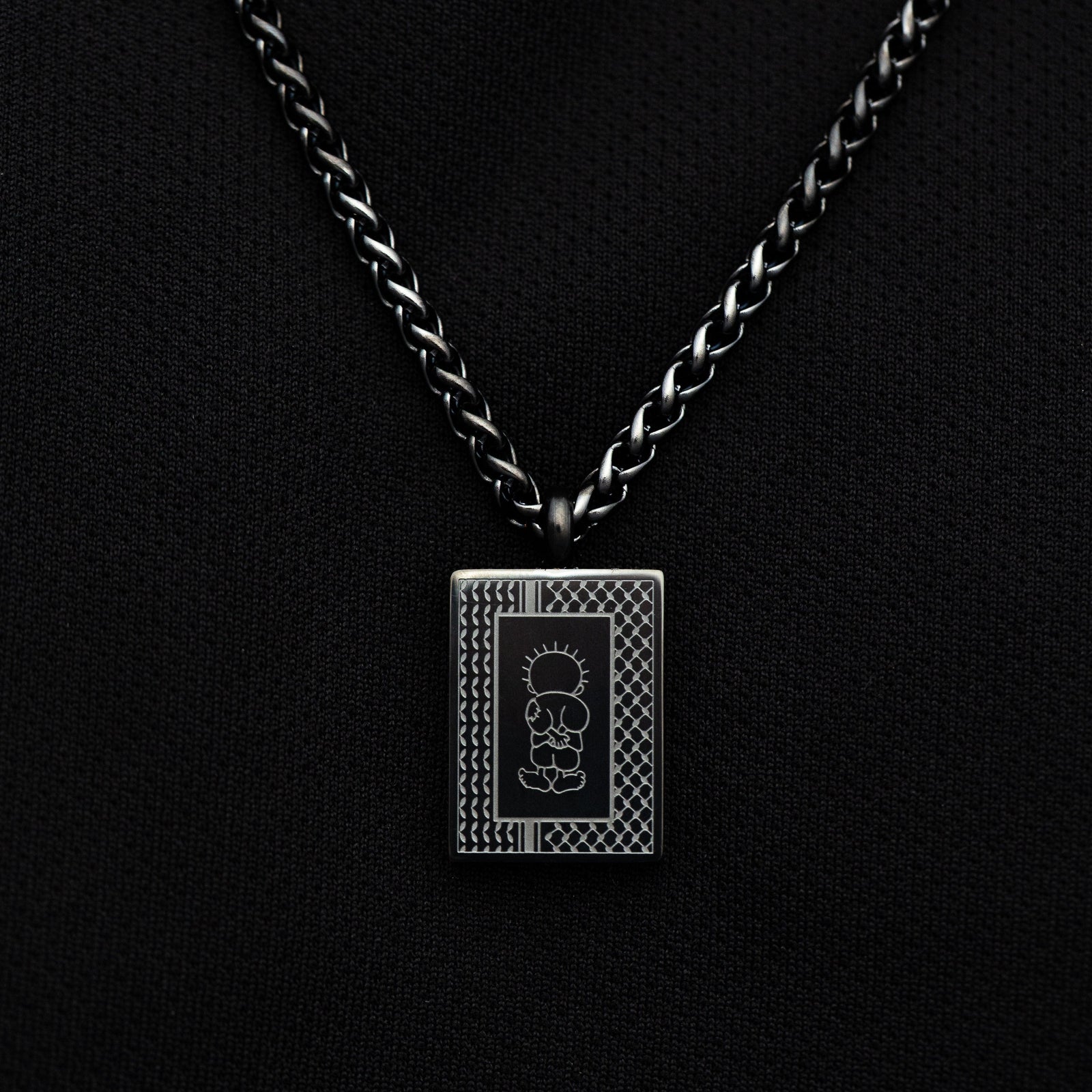 Black Handala Necklace on a black background