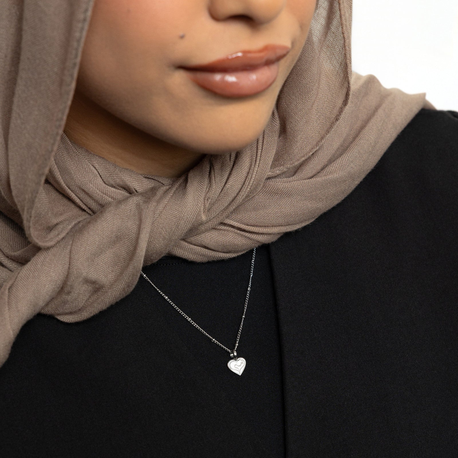 Photo of the silver Mother Love Necklace as worn by the model.