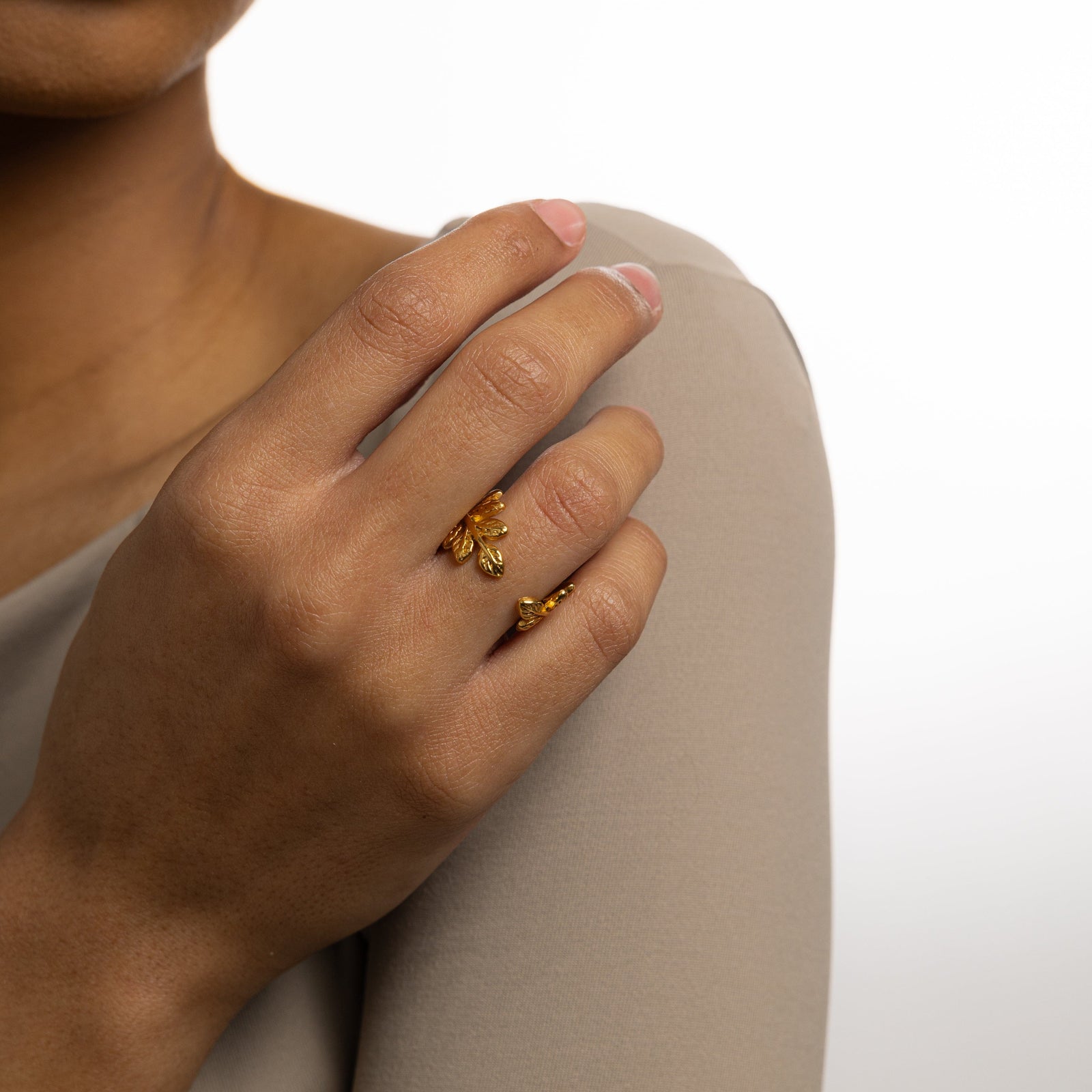 Gold Olive Branch Ring on model’s ring finger