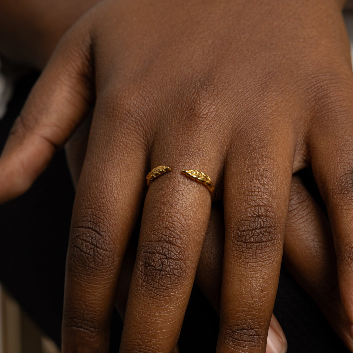 The Palestine Olive leaf ring V2 worn on a model's finger, showcasing the olive leaf design.