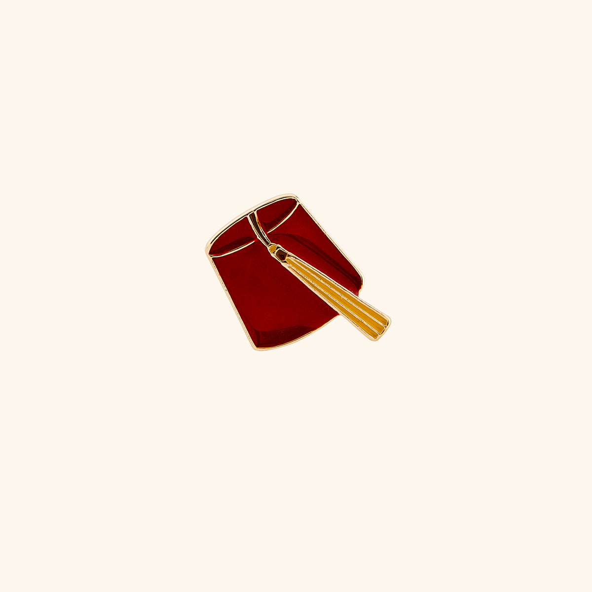 18k gold-plated Fez Pin set on a light background. 
