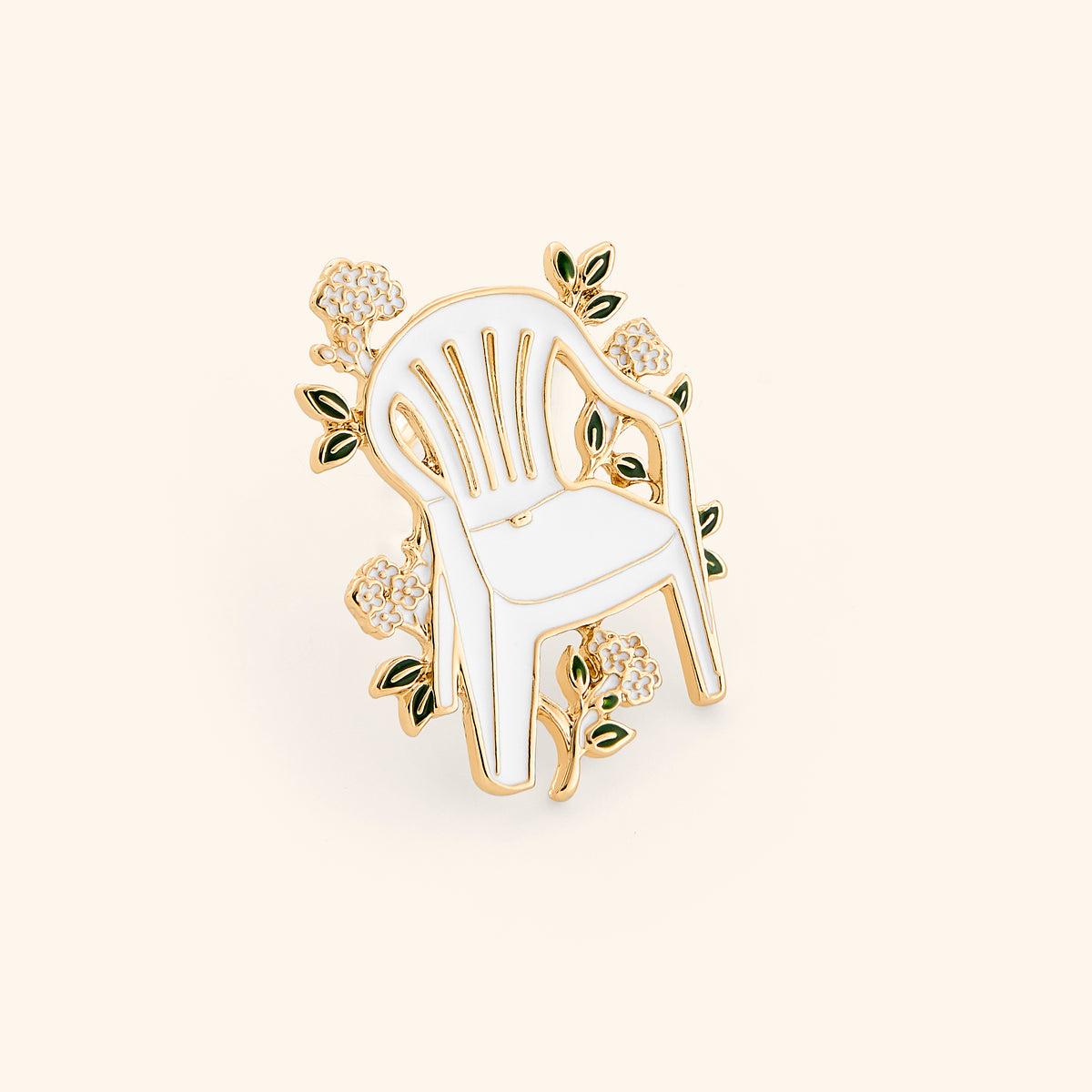 18k gold-plated Iconic Chair Pin set on a light background. 