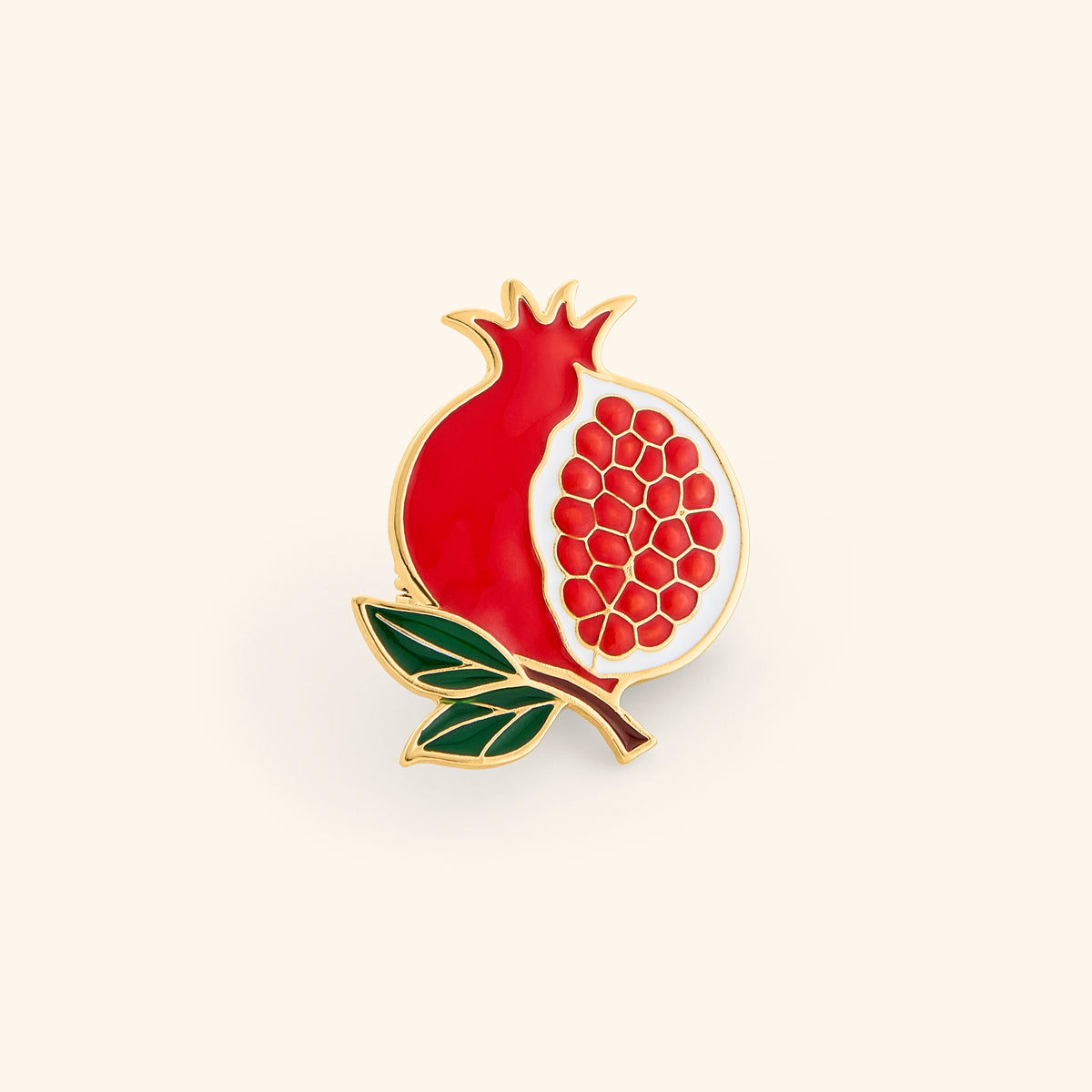 18k gold-plated Open Pomegranate Pin set on a light background. 