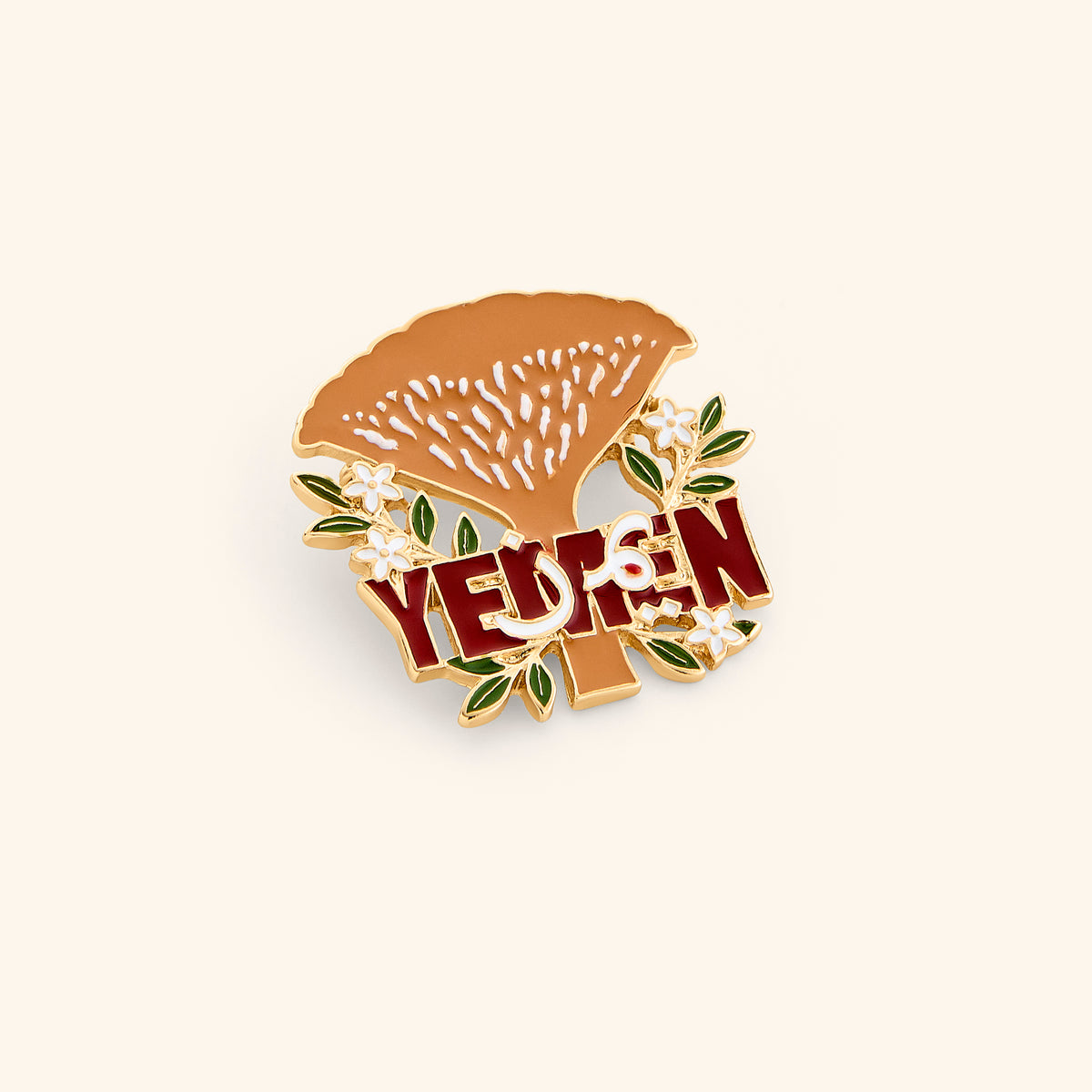 18k gold-plated Socotra Yemen Pin set on a light background. 