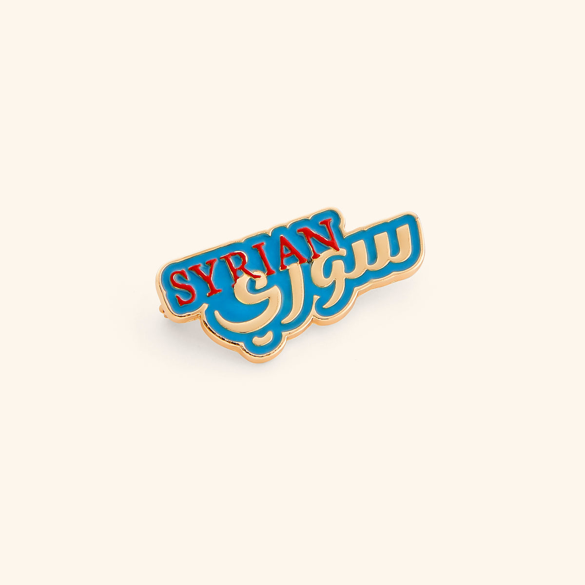 18k gold-plated Syrian Pin set on a light background. 
