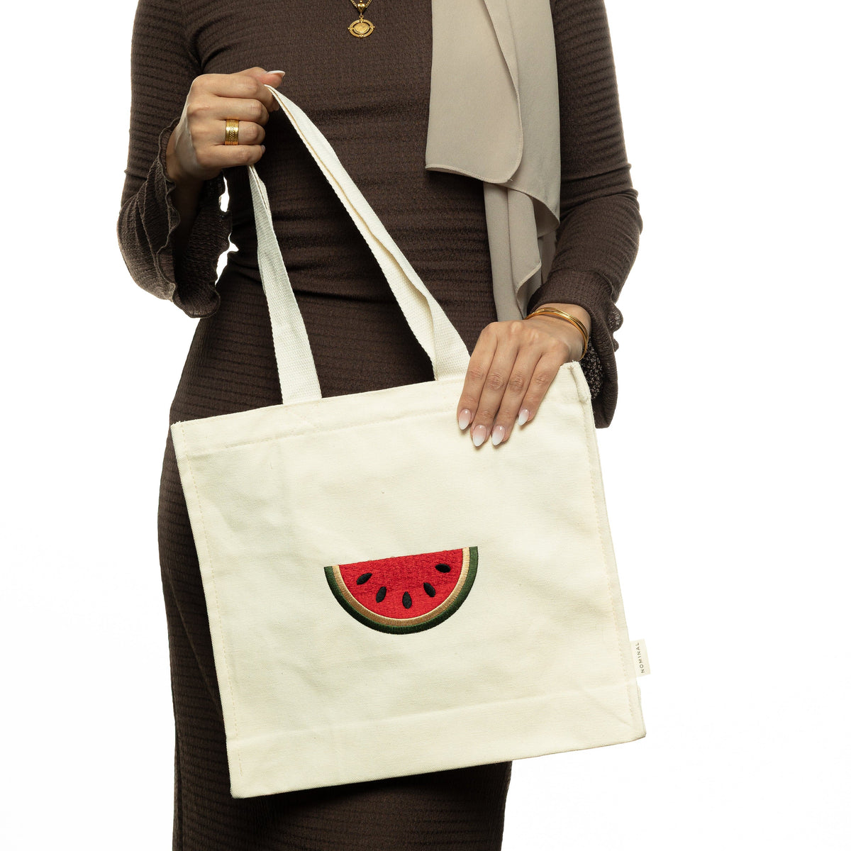 Photo of the model holding the Palestine Watermelon Tote.