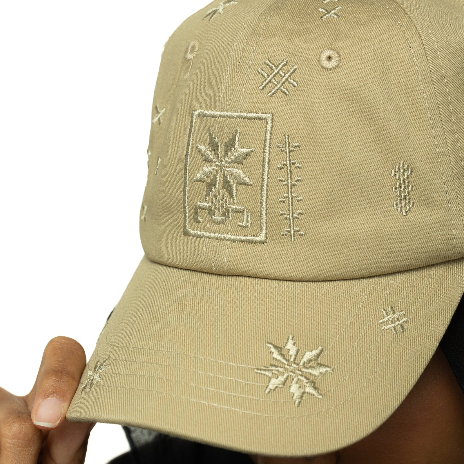Close up of the Palestinian Tatreez Hat as worn by the model.