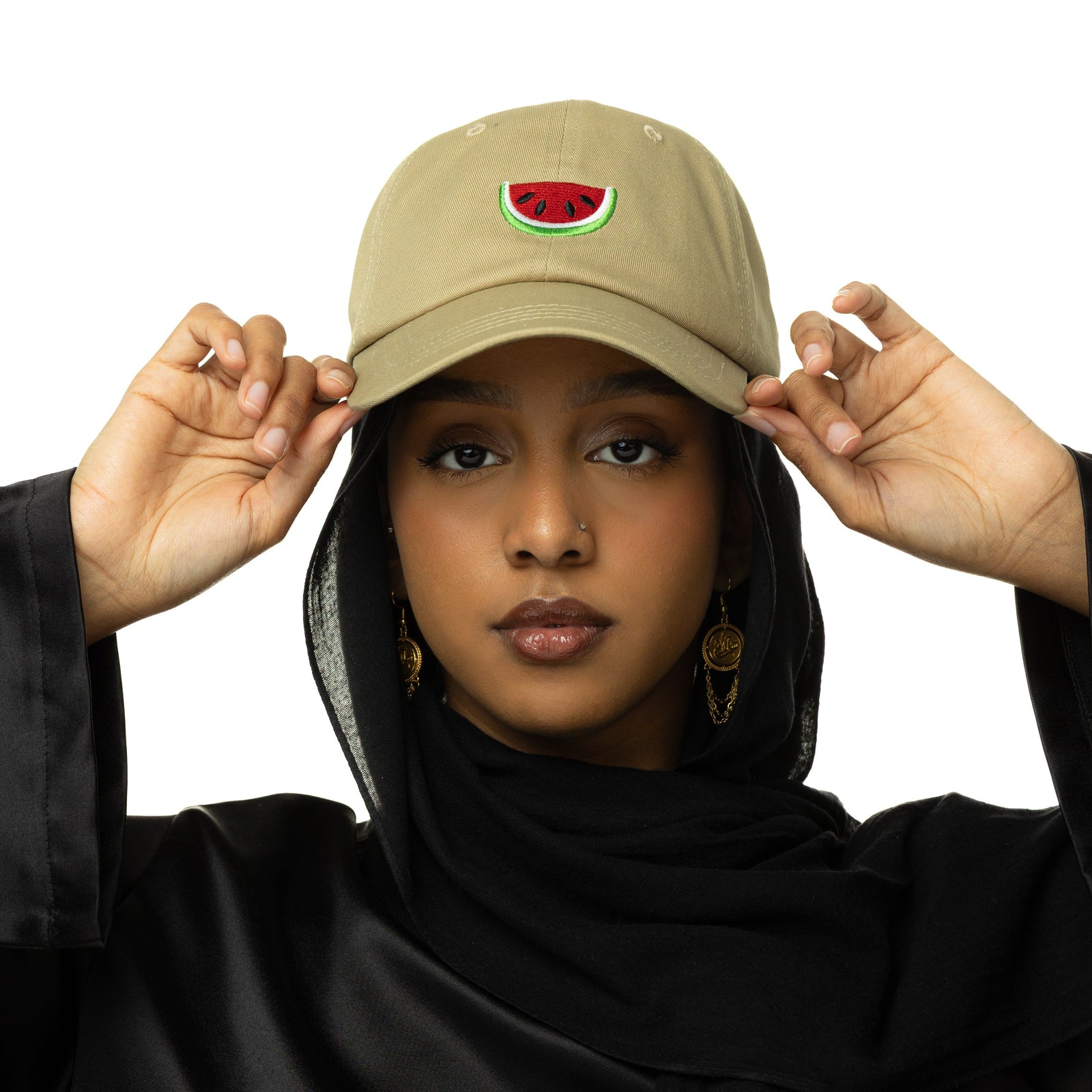 Photo of the model wearing the beige Palestinian Watermelon hat.