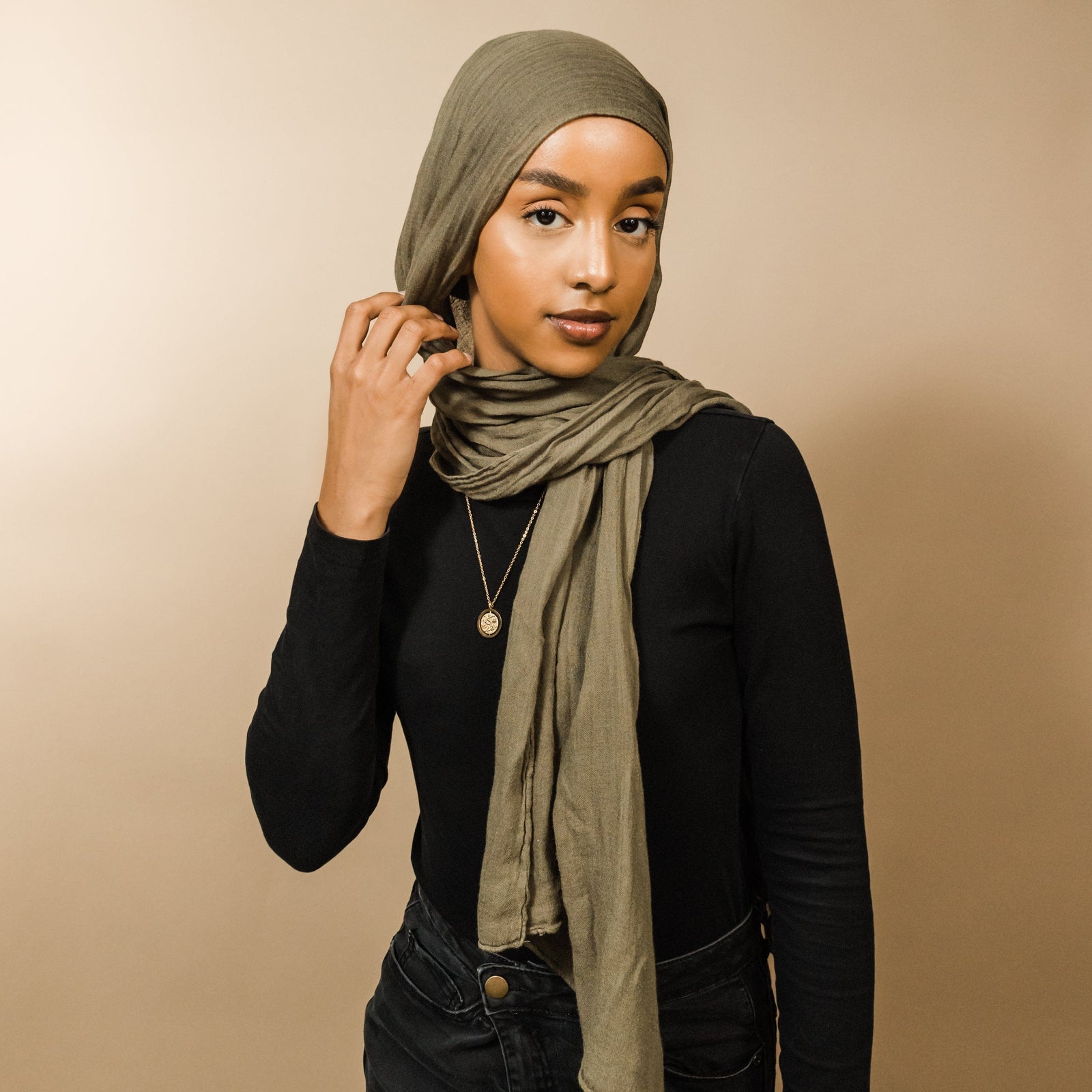 Photo of the model wearing the gold Everything Comes with Patience Necklace.Everything Comes with Patience Necklace | Women - Nominal.
