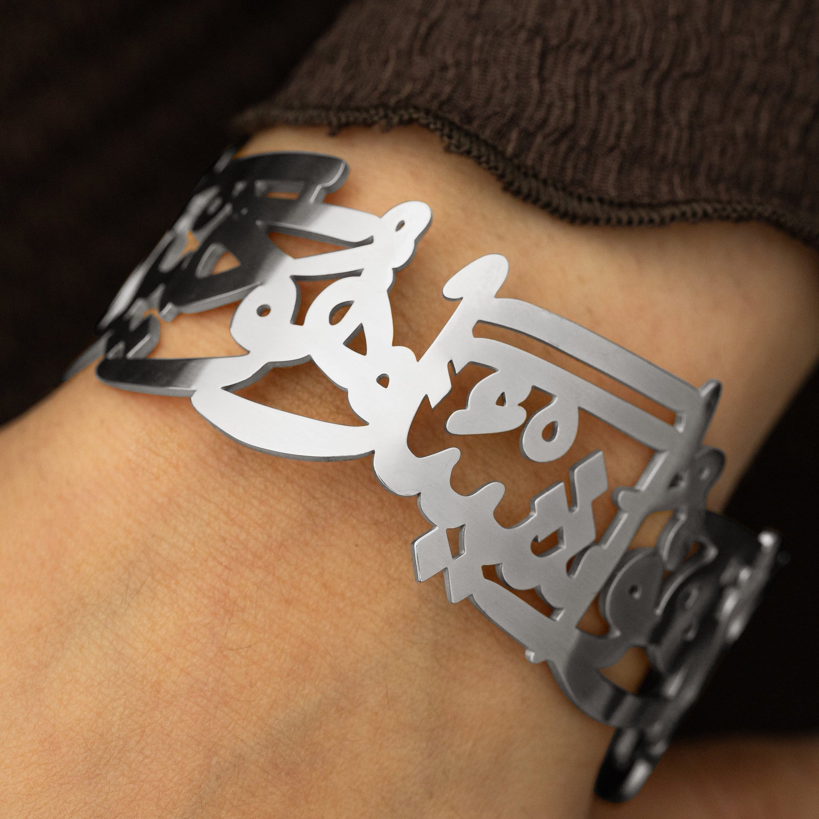 Silver ‘Perhaps you dislike something which is good for you’ Calligraphy Cuff.