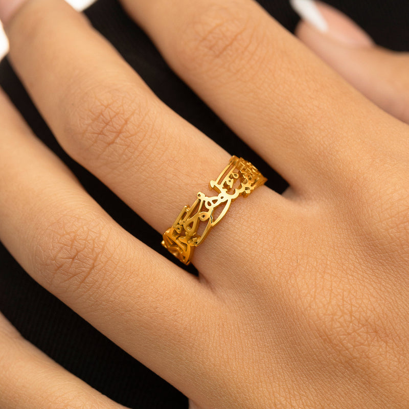 "Perhaps you dislike something which is good for you" Calligraphy Ring in gold worn on a woman's hand