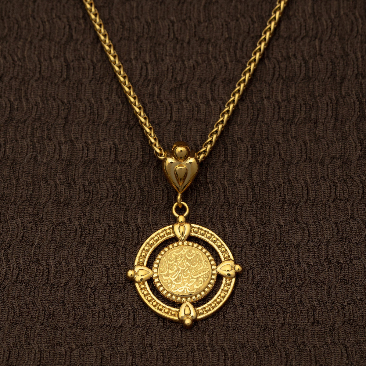 Close-up of the gold “Perhaps you dislike what's good for you” Coin Necklace