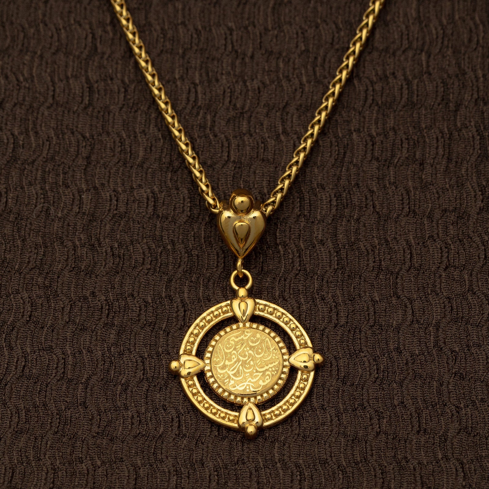 Close-up of the gold “Perhaps you dislike what's good for you” Coin Necklace