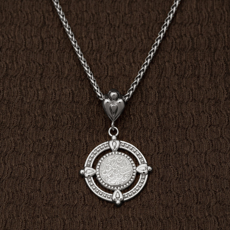 Close-up of the silver “Perhaps you dislike what's good for you” Coin Necklace