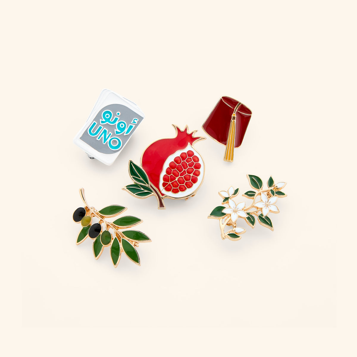 18k gold-plated enamel pin collection on a light background.