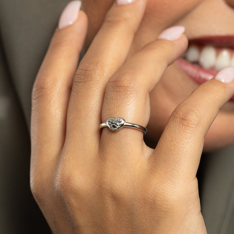 Hand wearing a silver Quwa | Strength Heart ring