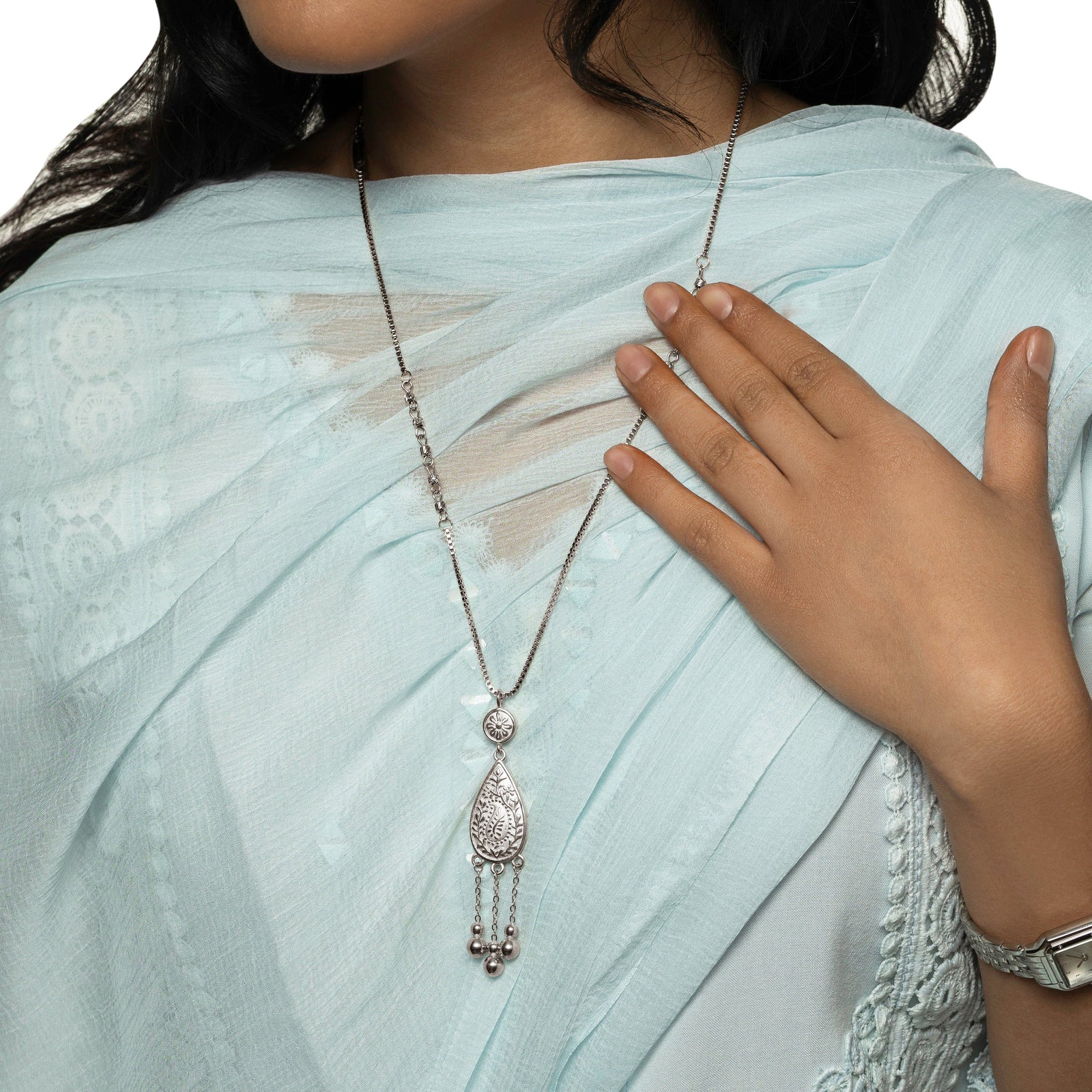 Close up of the thin silver chain of the Raining Paisley Necklace.