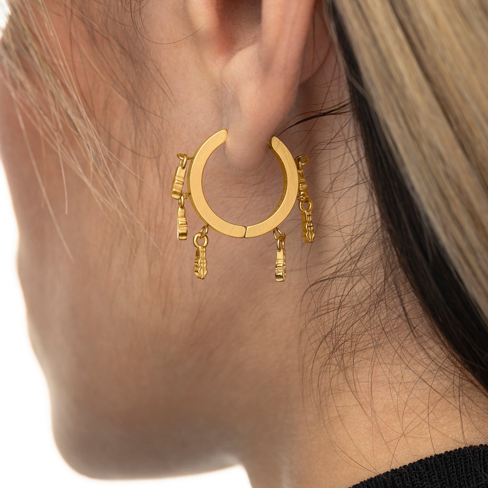 Close up of the gold Raining Tatreez Hoop Earrings.