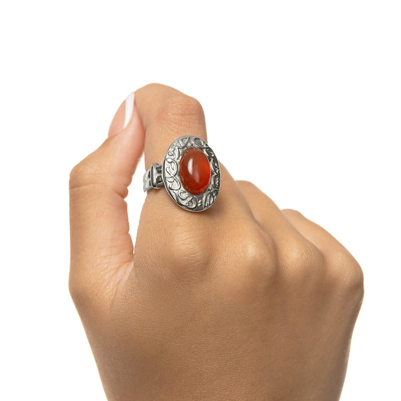 Hand wearing the Roots Don’t Fade Stone Ring in silver