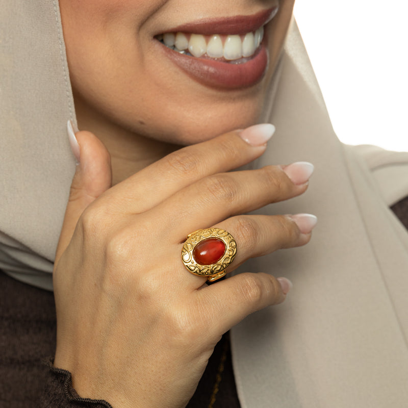 Model wearing the Roots Don’t Fade Stone Ring in gold