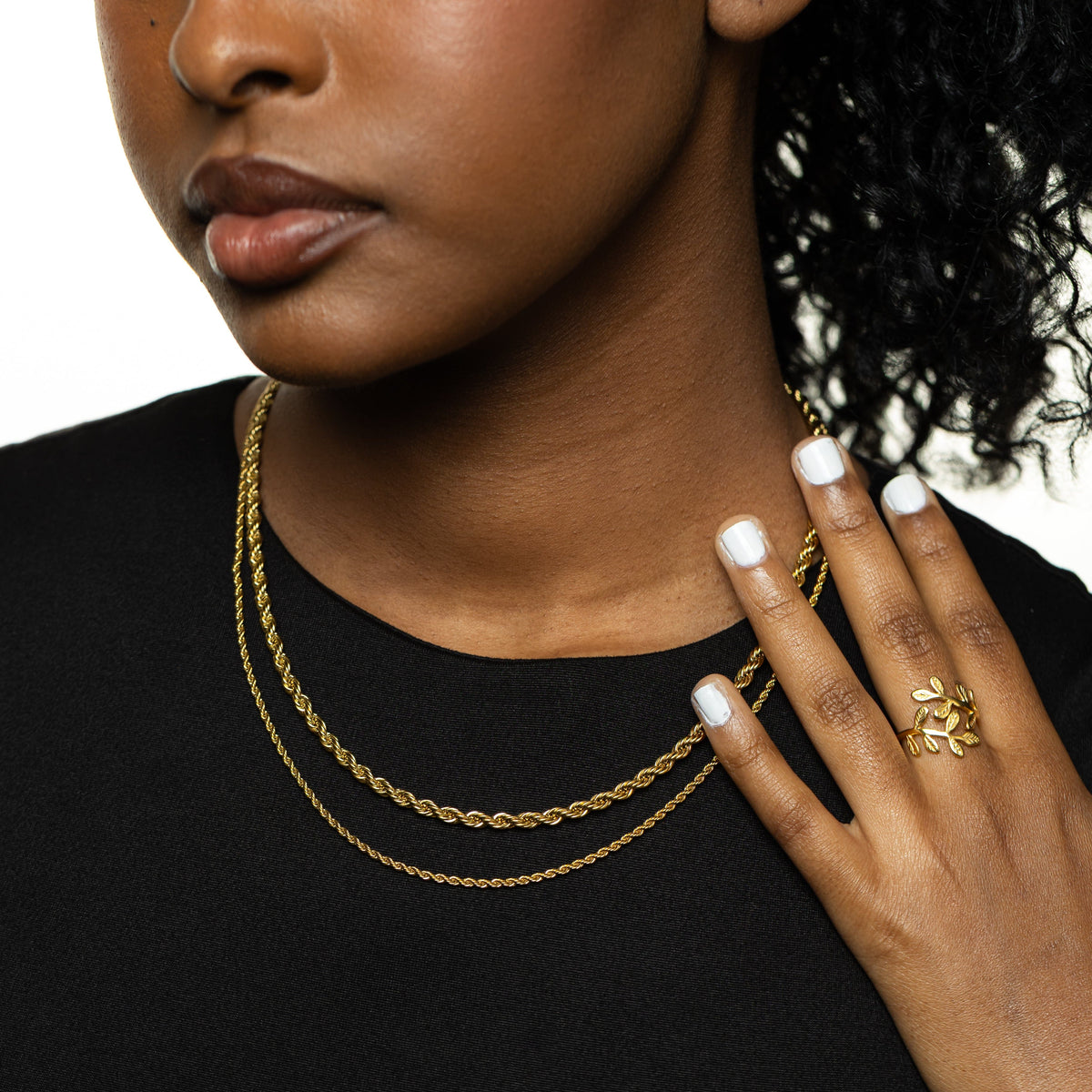 Close up of the gold Rope Chain Necklaces in different thickness as worn by the model.