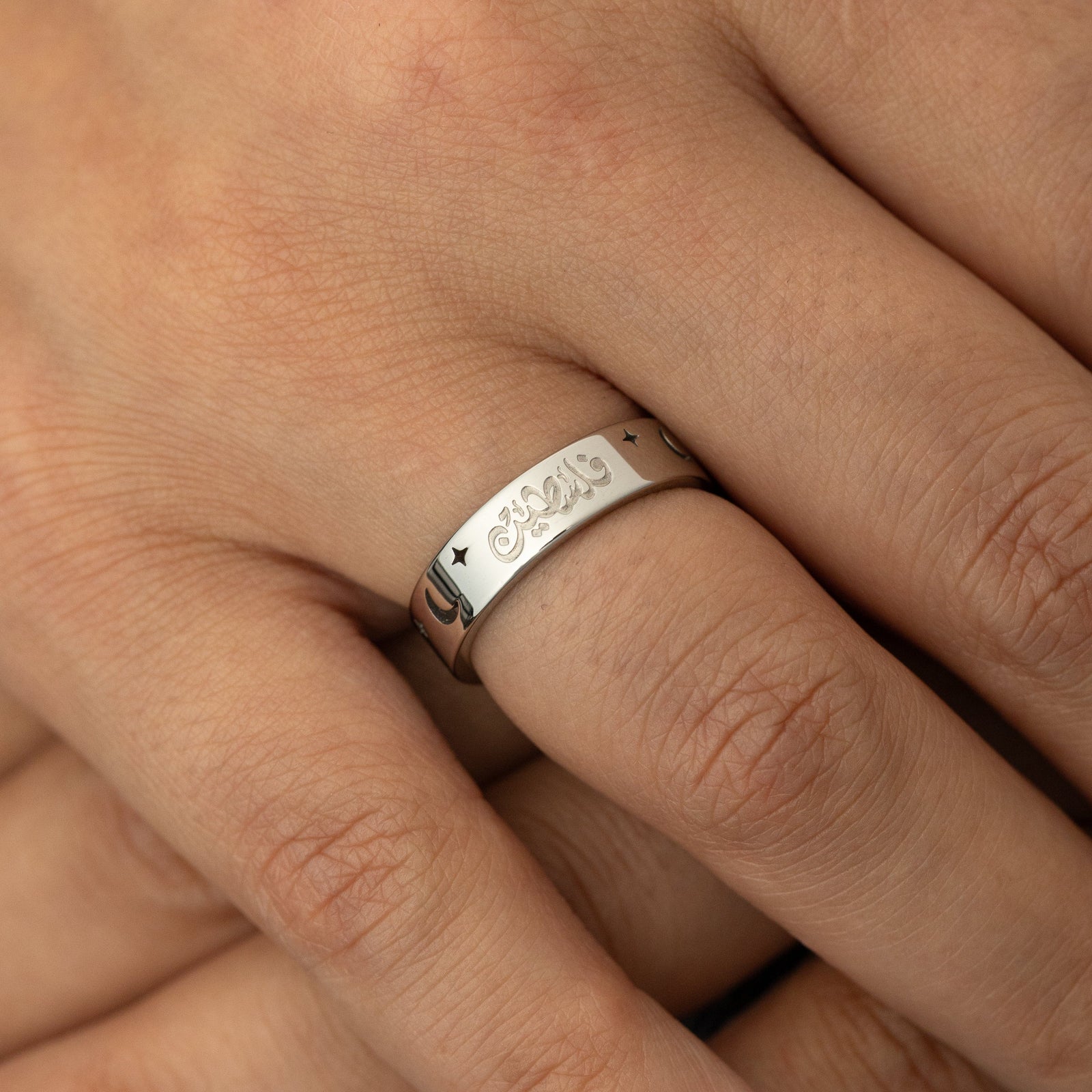 Silver Starlit Palestine ring on a finger