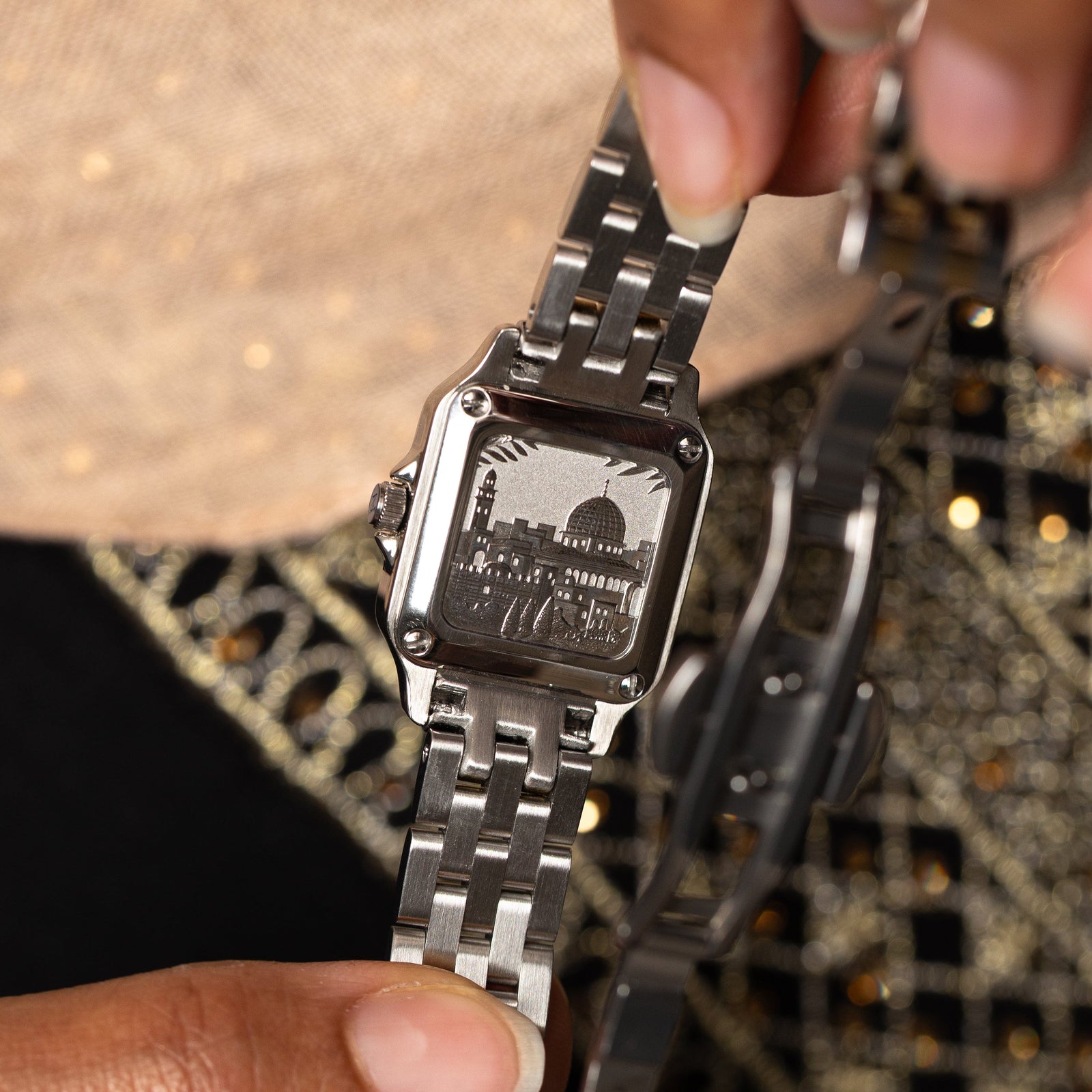 Inscribed on the back is a snapshot of the Al-Aqsa compound in Palestine.