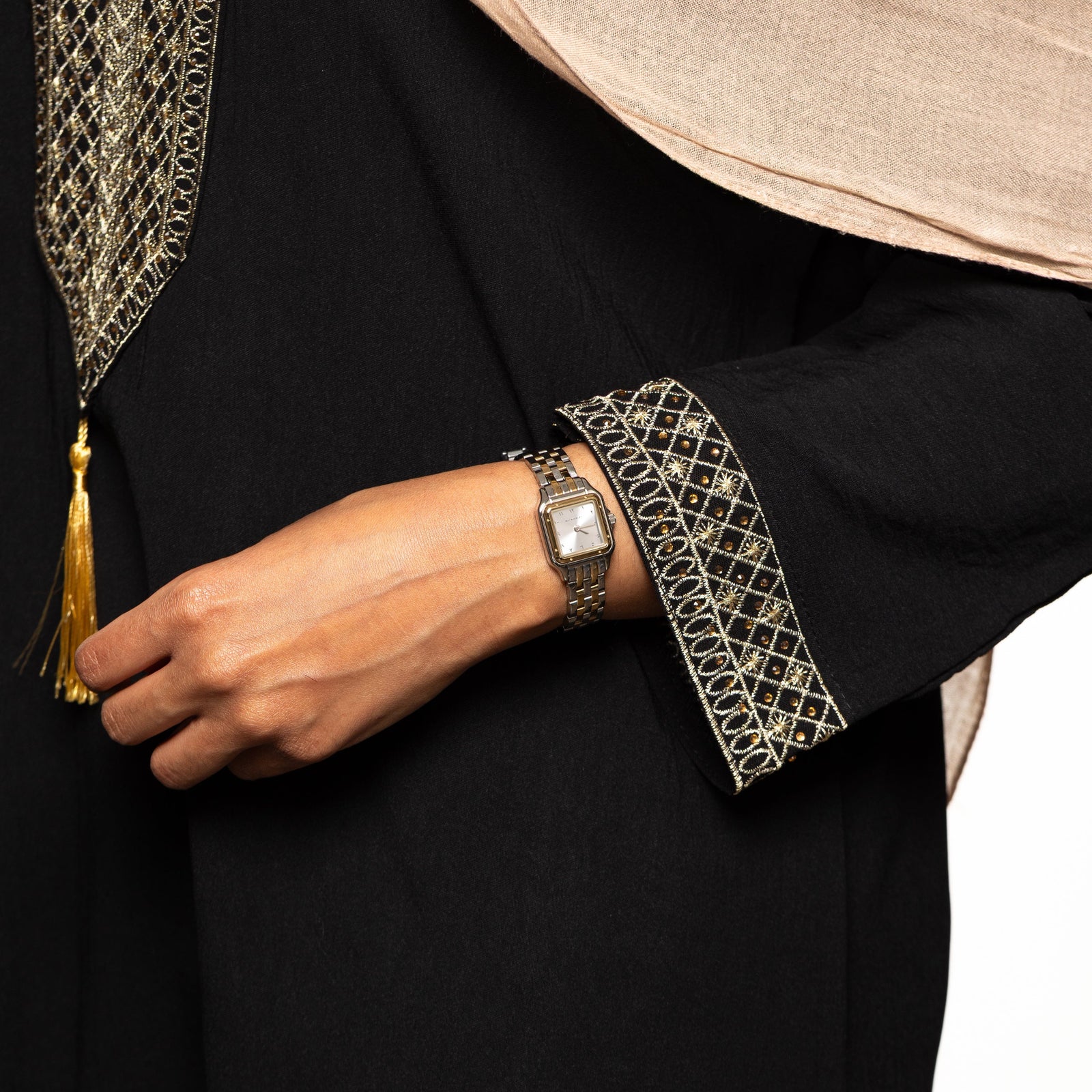 Photo of the model's left hand wearing the Sunrise watch.