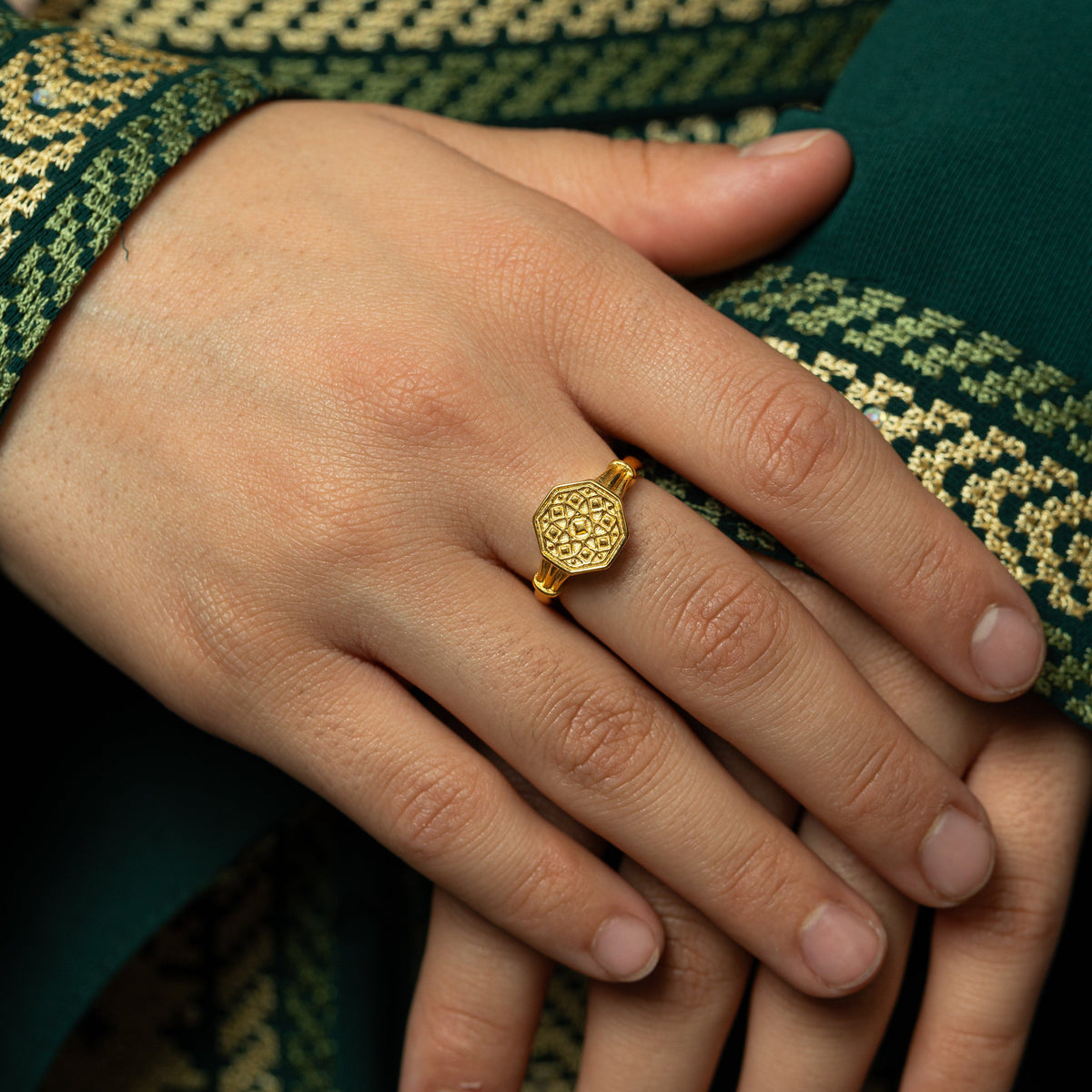 Close up of model's hands as showing the Syrian Mosaic Ring.