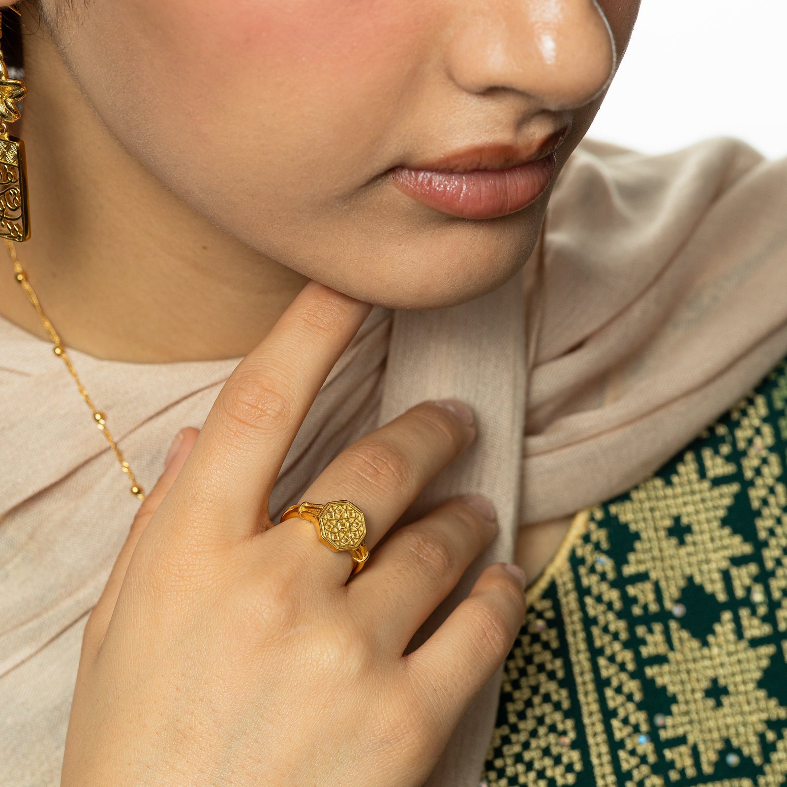 Model wearing the gold Syrian Mosaic Ring on their finger.