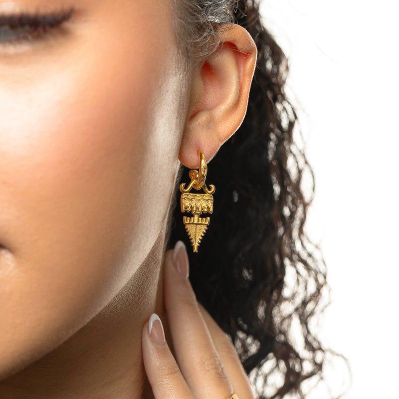Woman wearing gold Tatreez Earrings