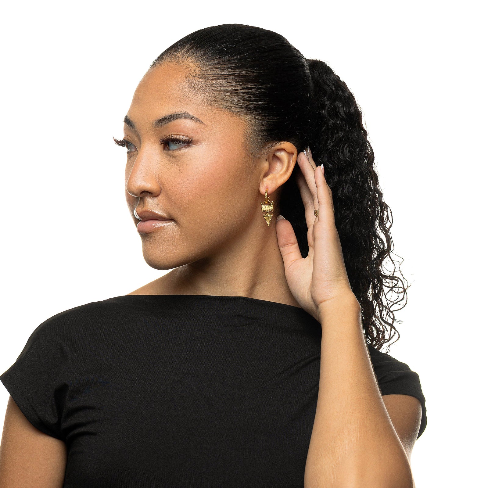 Woman wearing gold Tatreez Earrings