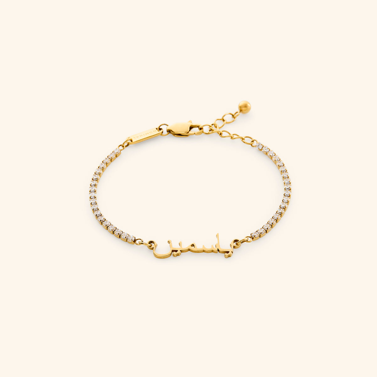 18k gold-plated Tennis Name Bracelet featuring a clear pavé crystal chain with a central custom Arabic calligraphy nameplate.