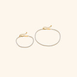 18k gold-plated Tennis Set featuring the Tennis Bracelet and Tennis Anklet.