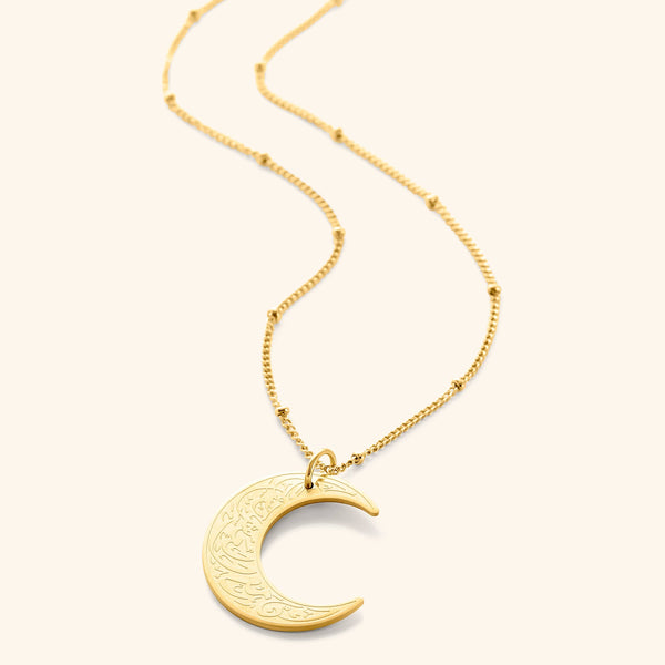 A gold crescent moon necklace