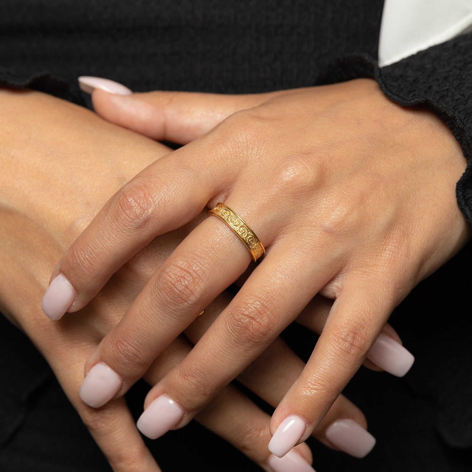 Close-up of hands with a gold vintage heritage  ring