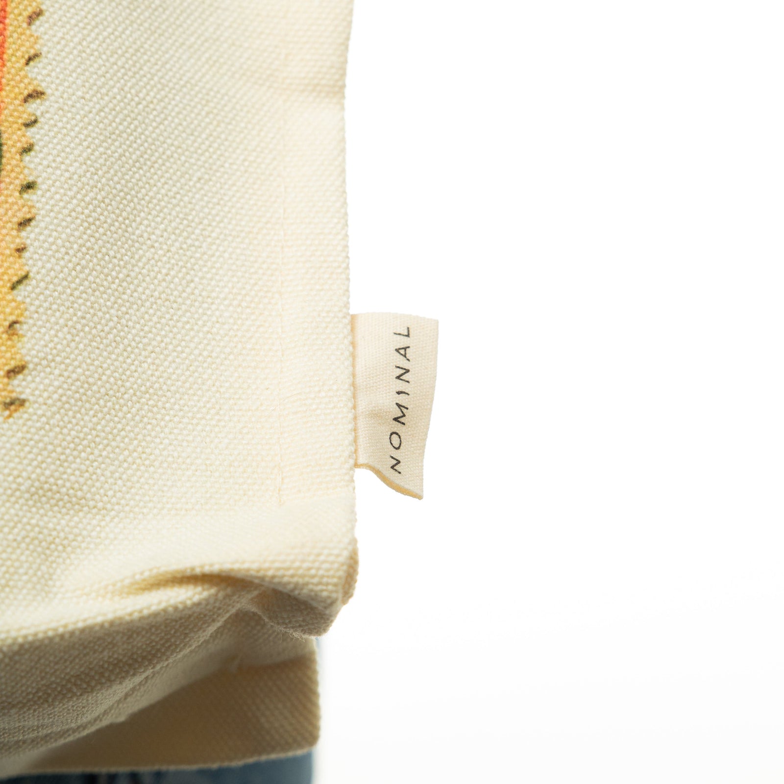 Close up of the Nominal tag on the Vintage Stamp Tote