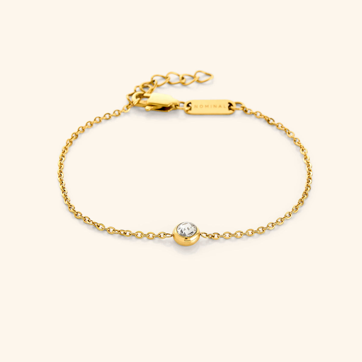 Flat lay of the 18k gold plated bracelet. Marked by a minimal gemstone, our all new Bezel Bracelet features a beautiful finish that delivers an elegant piece to your wardrobe for any day, any occasion.