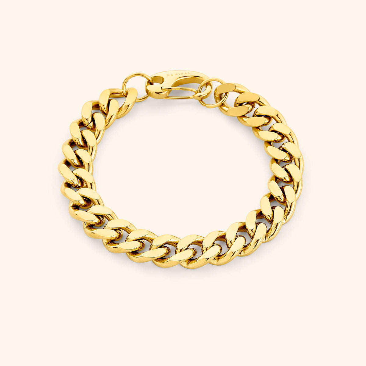 Flat lay of the 18k gold plated 10MM chunky cuban bracelet that features a closure clasp.